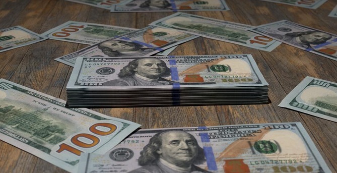  الدولار يقلص خسائره في ظل ارتفاع العوائد 