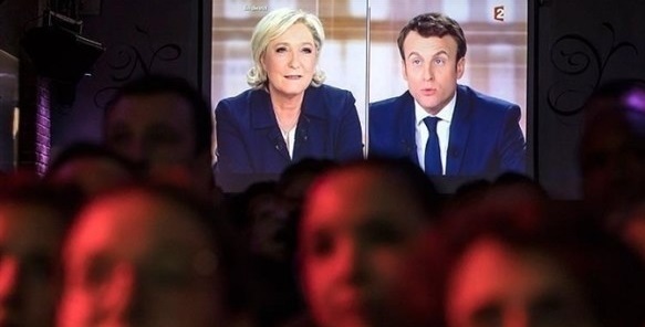  ماكرون يتقدم على لوبان في الاستطلاعات 